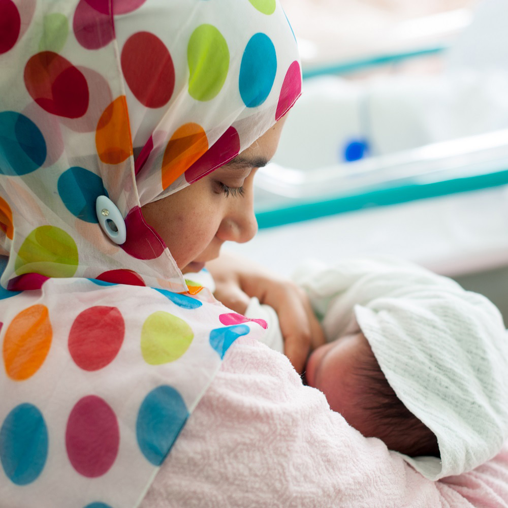 Mother holding infant