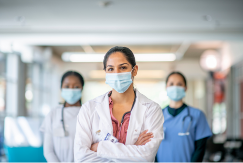 Photo of 3 masked healthcare providers