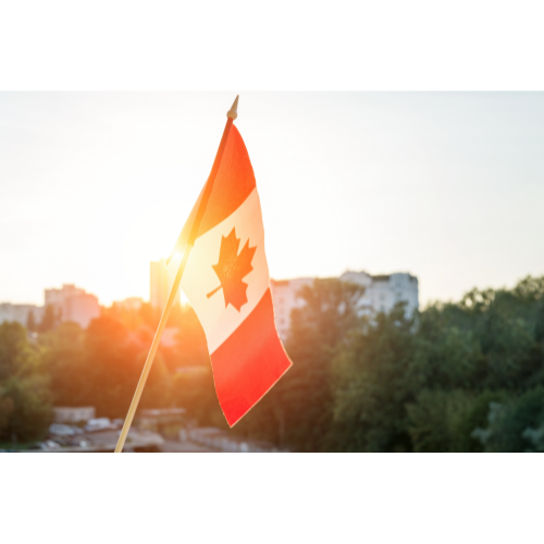 Flag of Canada against urban backdrop