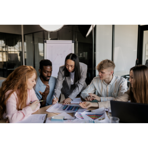 Co-workers brainstorming together at table