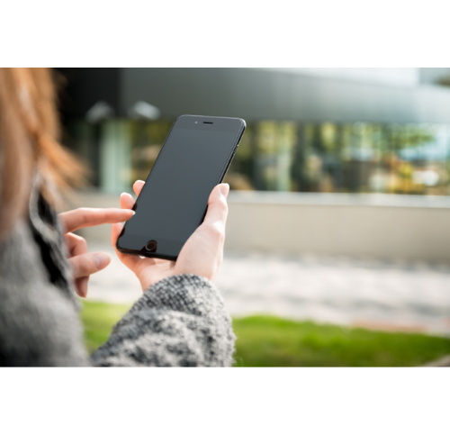 Person with red hair using smartphone