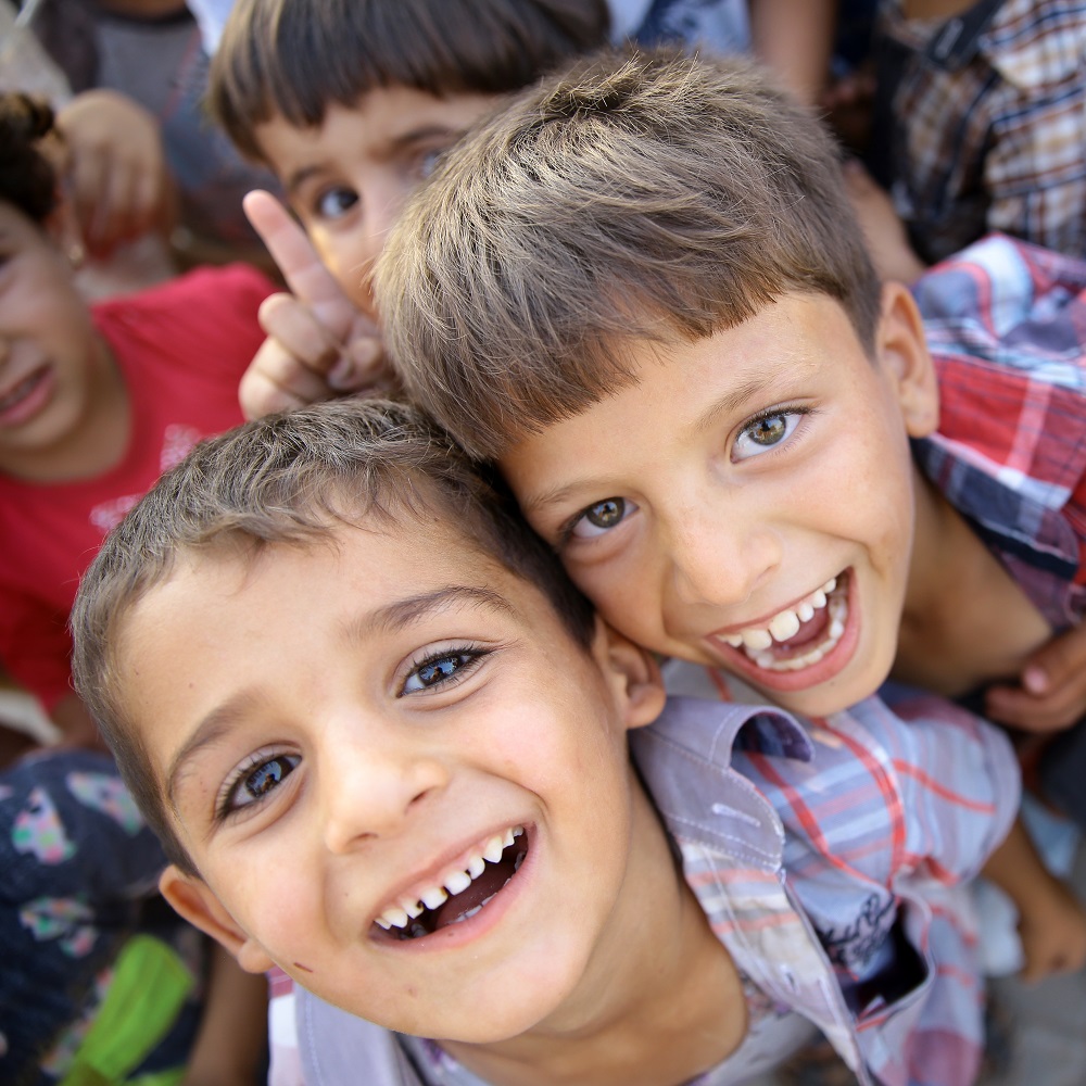 Photo of two smiling young children