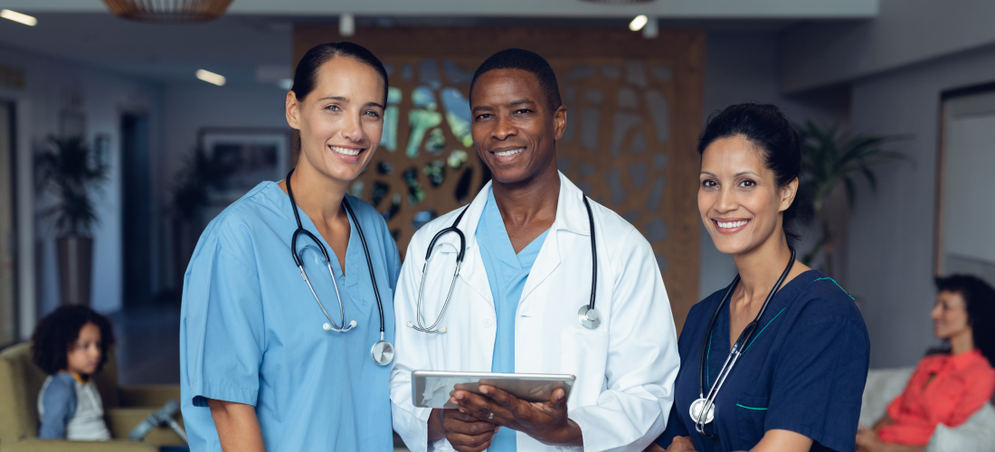 Three health professionals standing next to each other