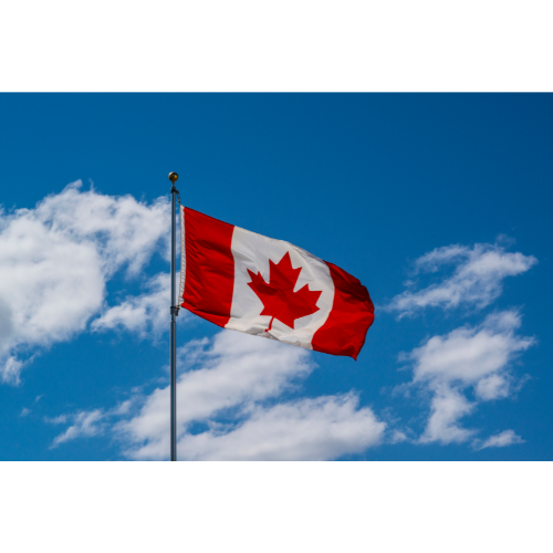 Canadian flag against blue sky