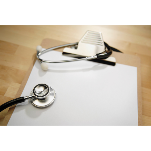 Stethoscope on top of blank clipboard